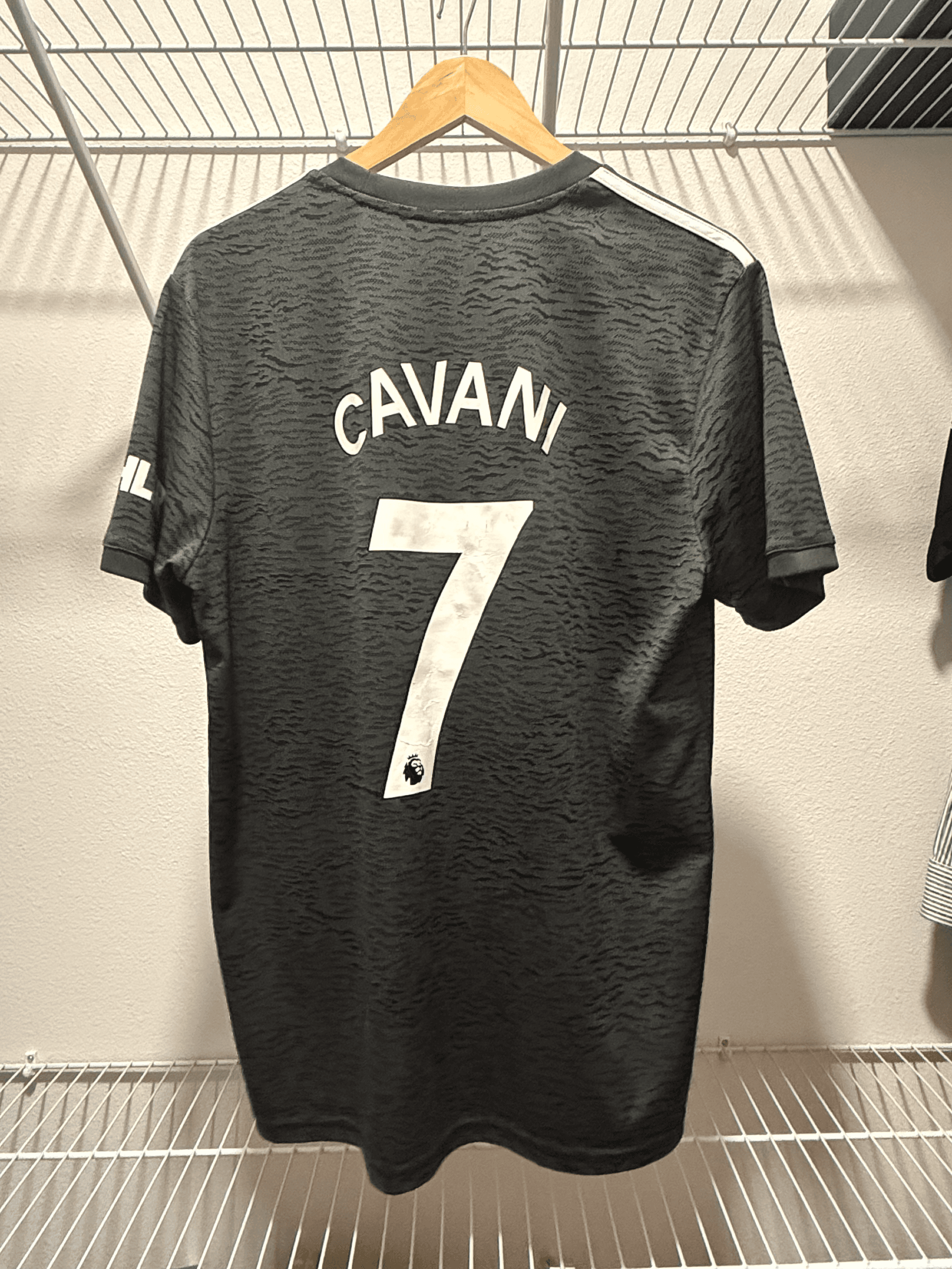 Manchester United 2020/21 home shirt held by @mgrauer02_f5bf2, back print
